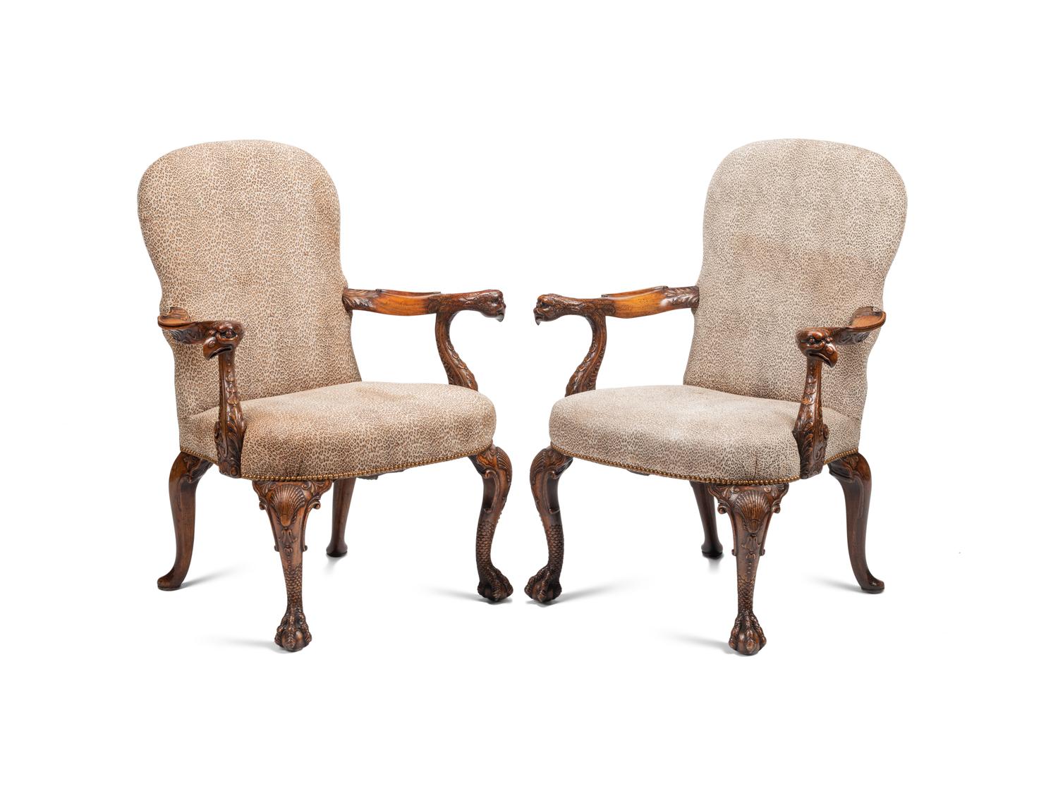 A Pair of George III Style Carved Walnut Library Armchairs