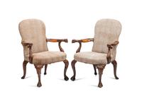 A Pair of George III Style Carved Walnut Library Armchairs