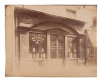 A group of four photographs ( Untitled [man at fountain], circa 1900s; Boutique empire, 14 rue de Grammont , 1903-1904; Hôtel de Neuville, rue Alphonse de Neuville, 1905-1906; Fontaine, faubourg Saint-Martin, 1912)
