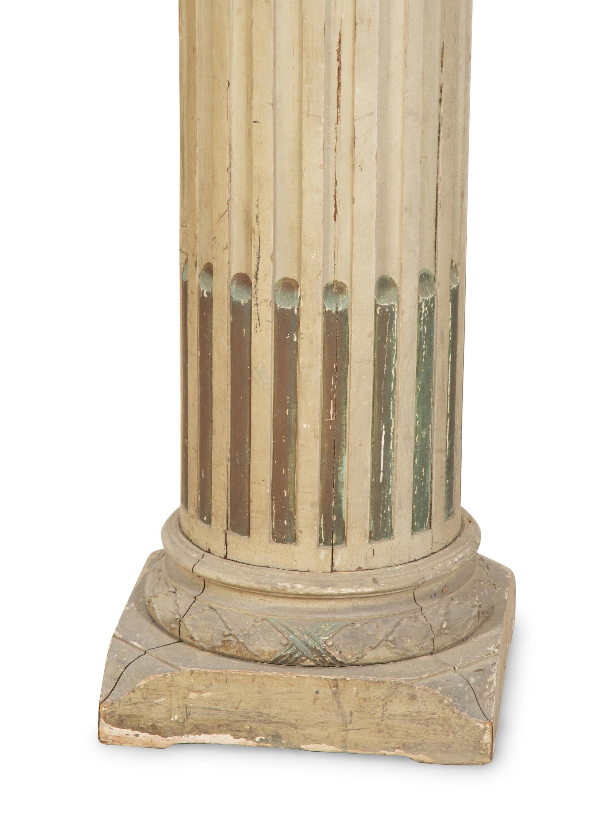 A Pair of Italian Carved and Painted Pedestals