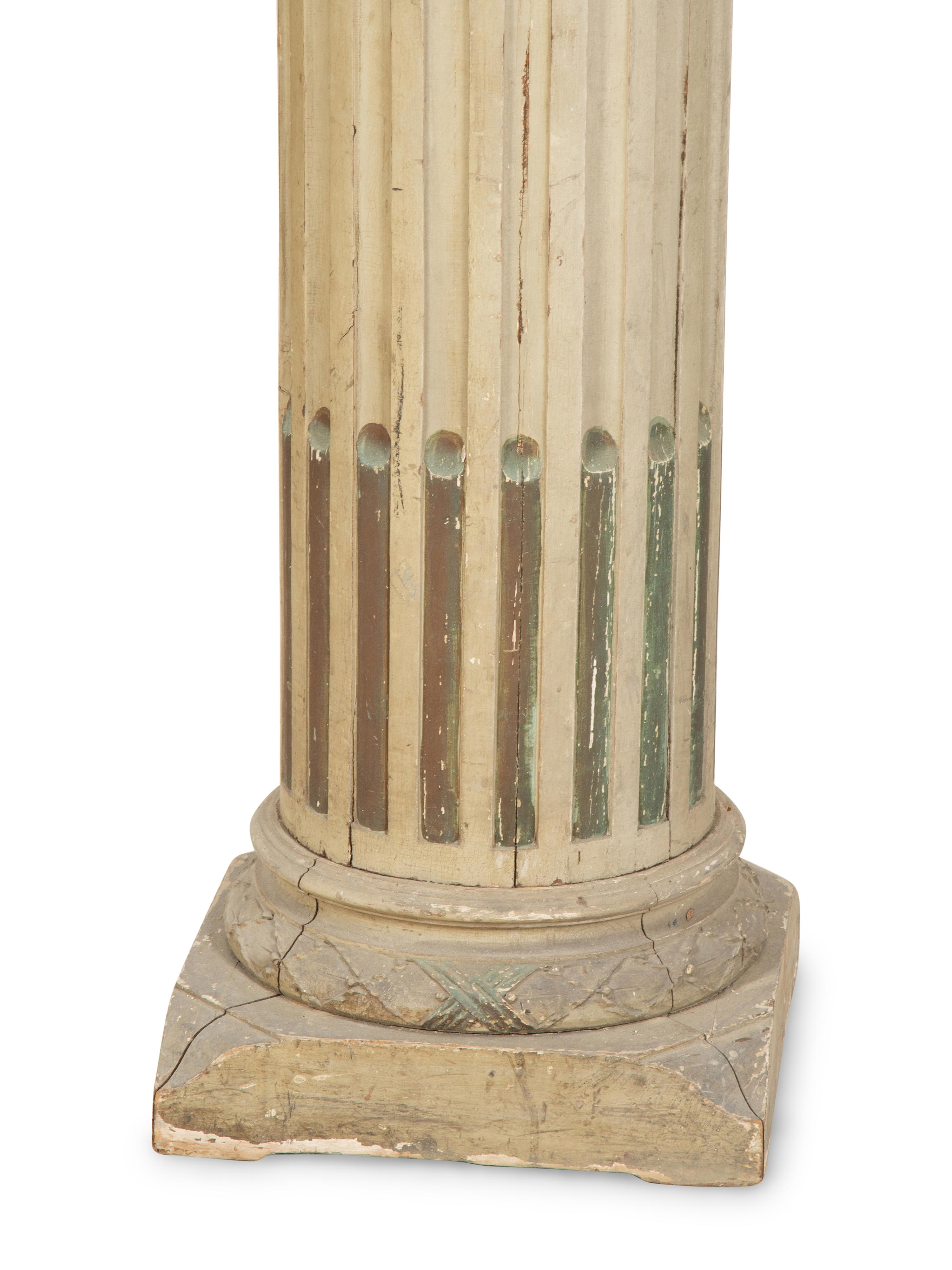 A Pair of Italian Carved and Painted Pedestals