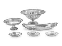 comprising an oval serving dish, three nut dishes, a compote, and a weighted compote.
