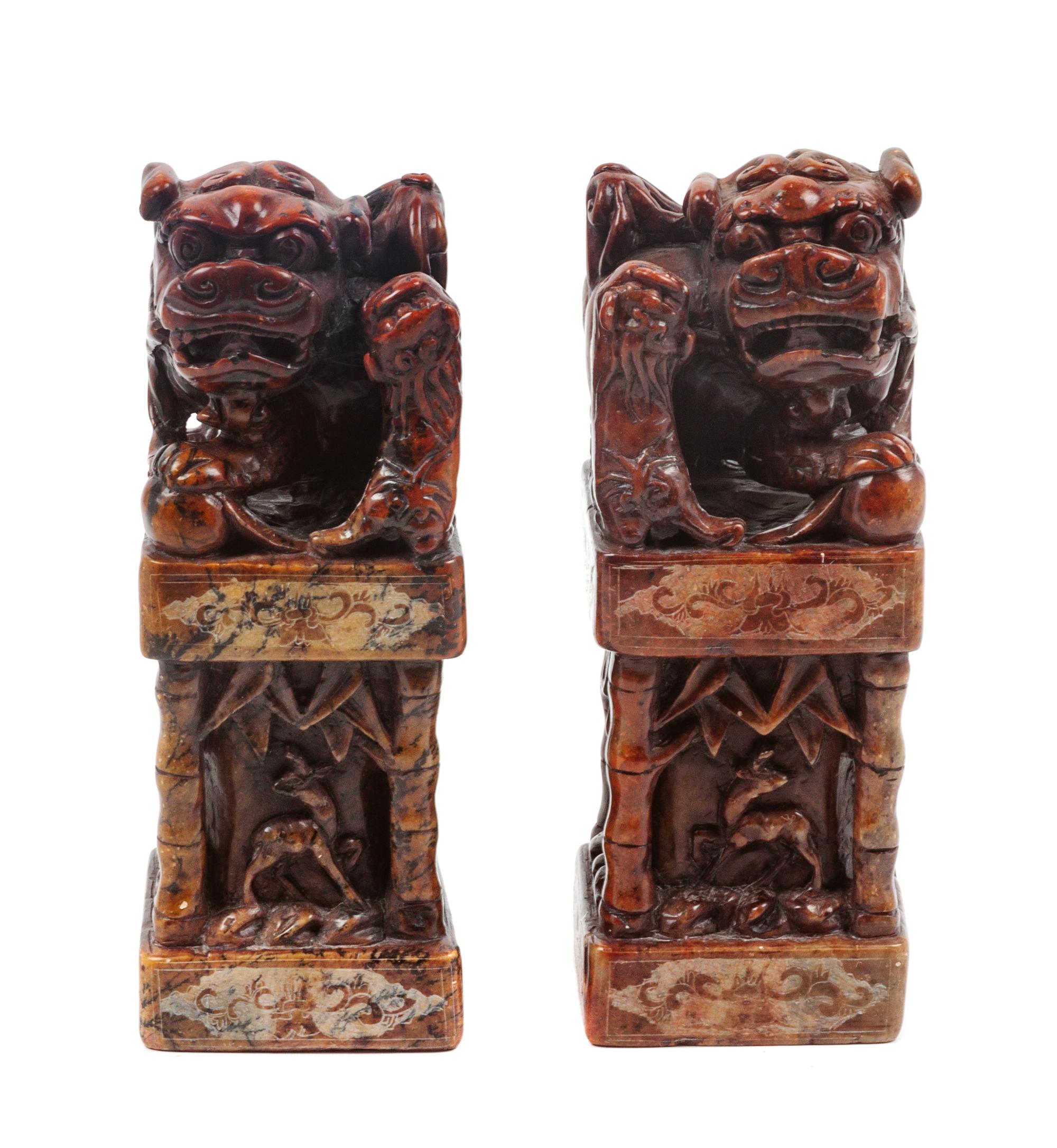 A Pair of Chinese Foo Dog Soapstone Stamp Sealers Height 8 inches.