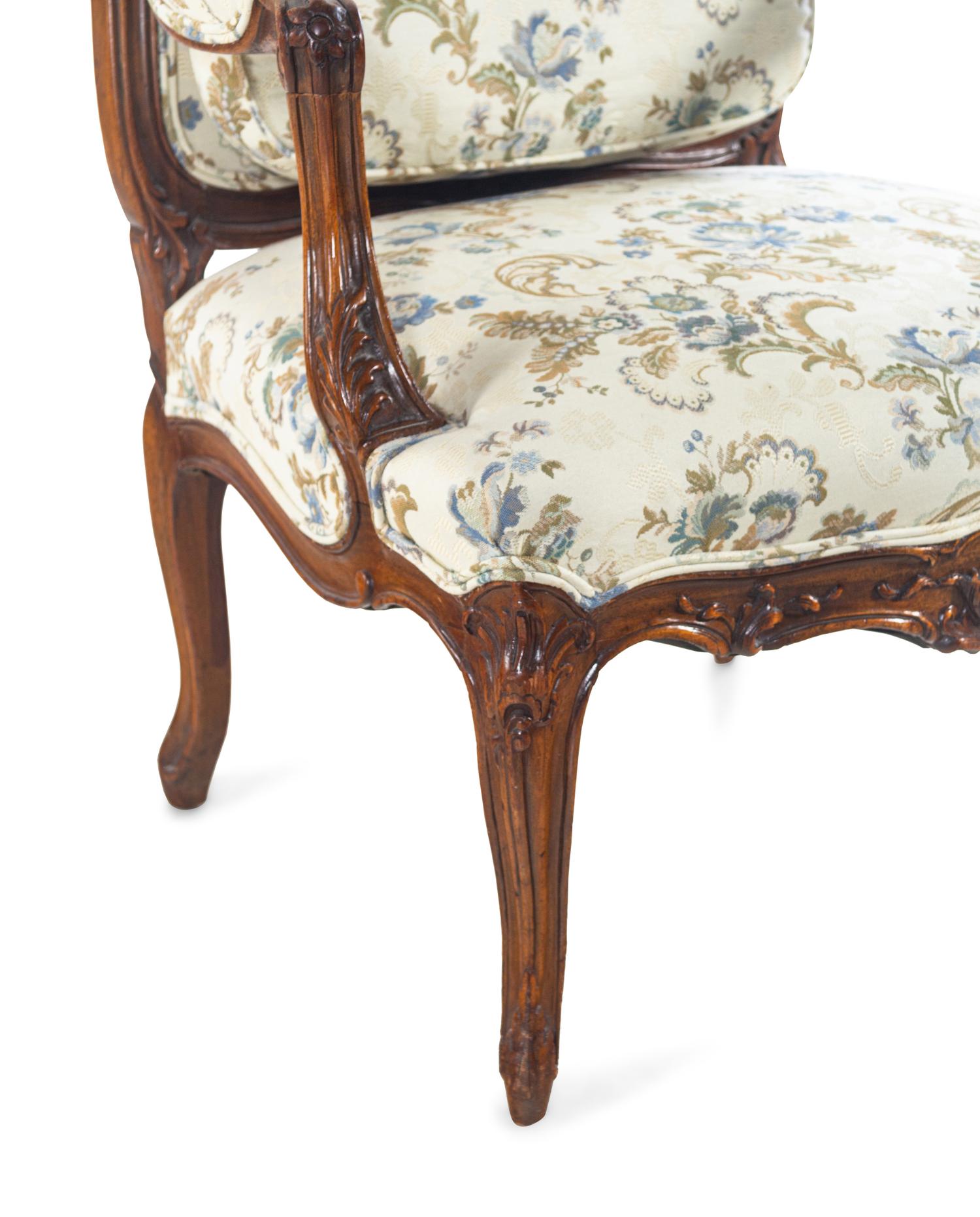 A Louis XV Style Carved Walnut Fauteuil