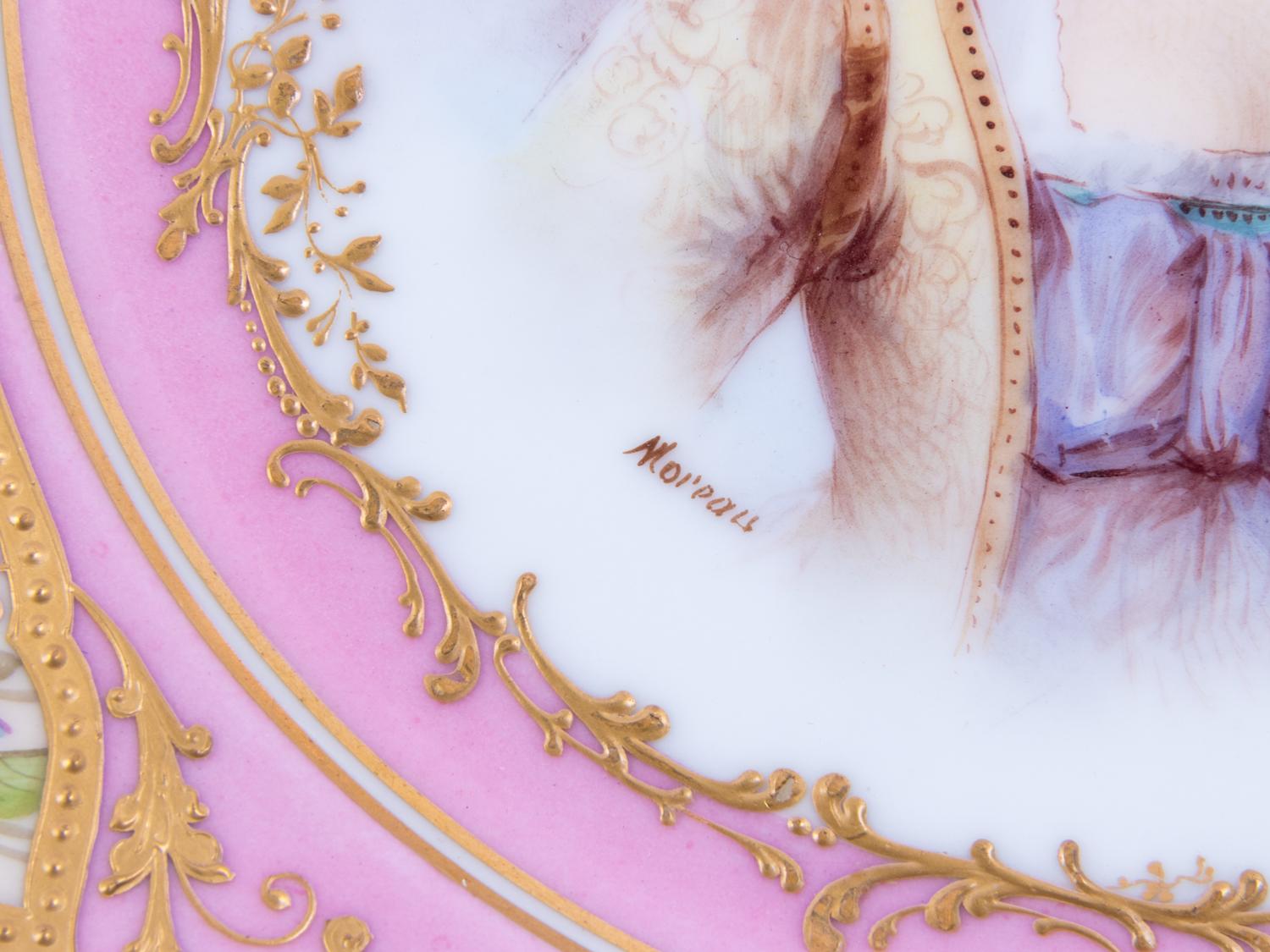 A Pair of Sèvres Painted and Parcel Gilt Pink-Ground Porcelain Plates