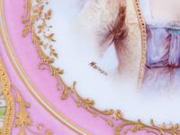 A Pair of Sèvres Painted and Parcel Gilt Pink-Ground Porcelain Plates