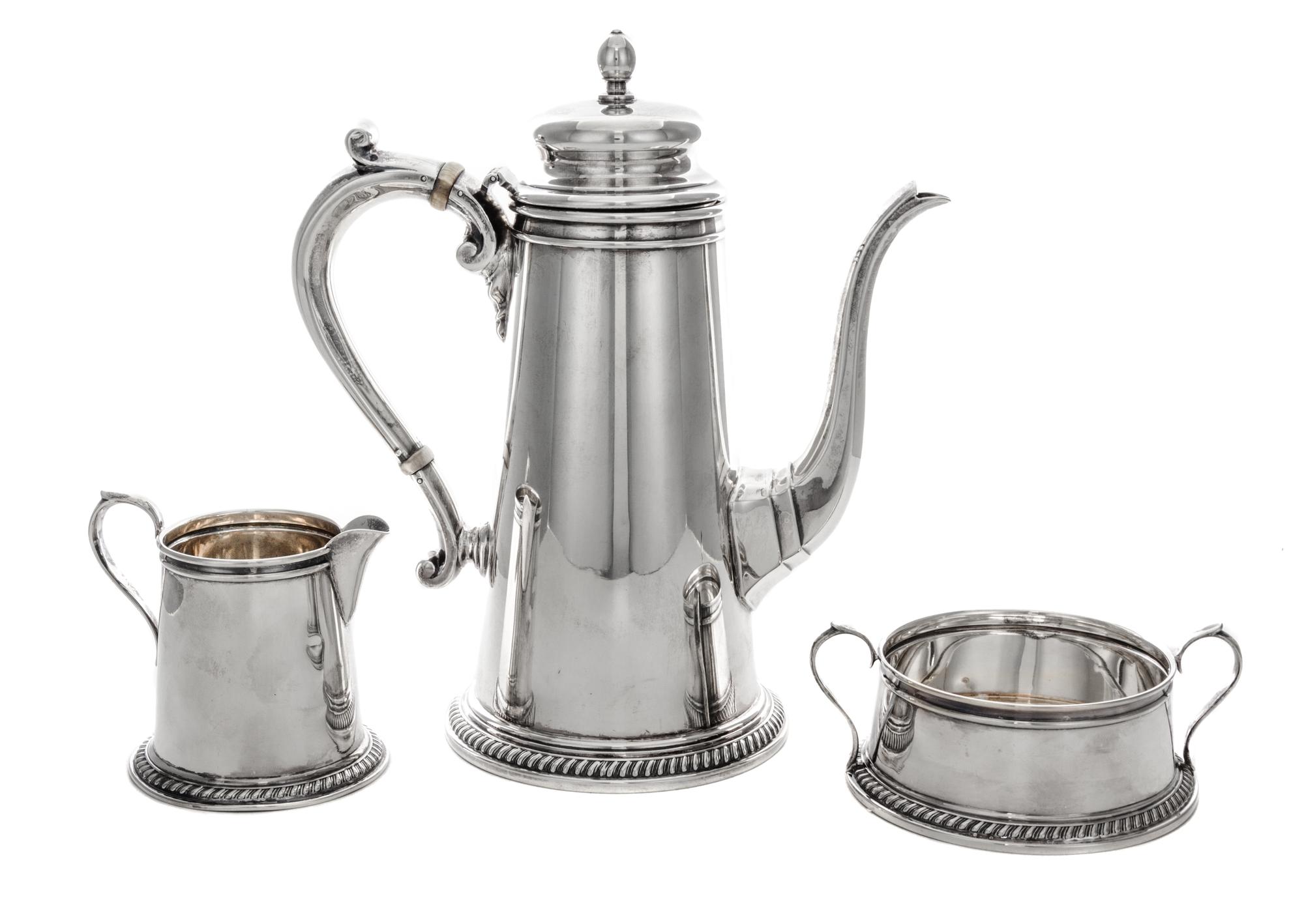 An American Silver Chocolate Set, Reed & Barton, Taunton, MA, 1939-1940, comprisng a chocolate pot, a milk pitcher and a sugar.