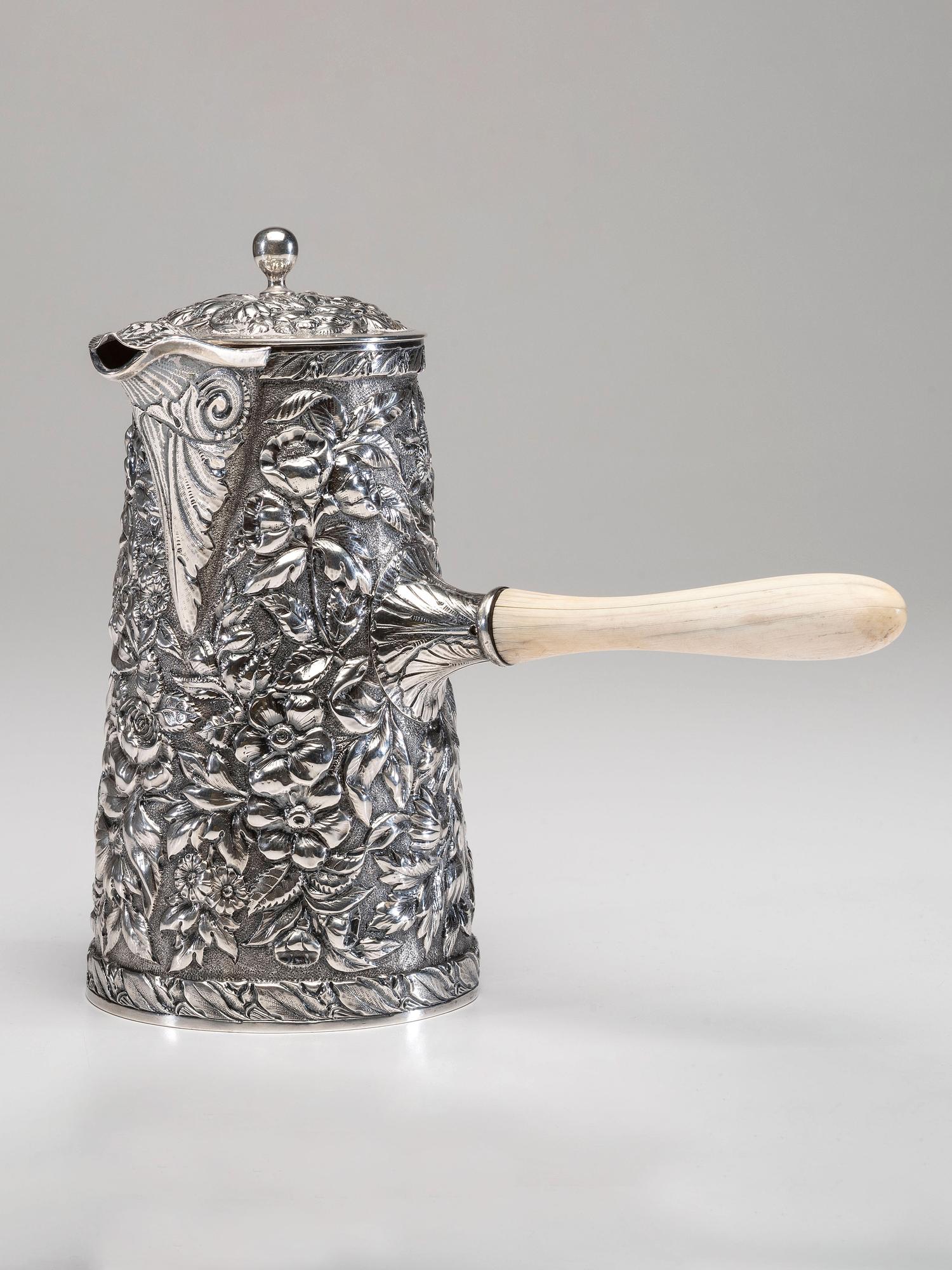 An American Silver Repoussé Chocolate Pot