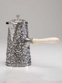 An American Silver Repoussé Chocolate Pot