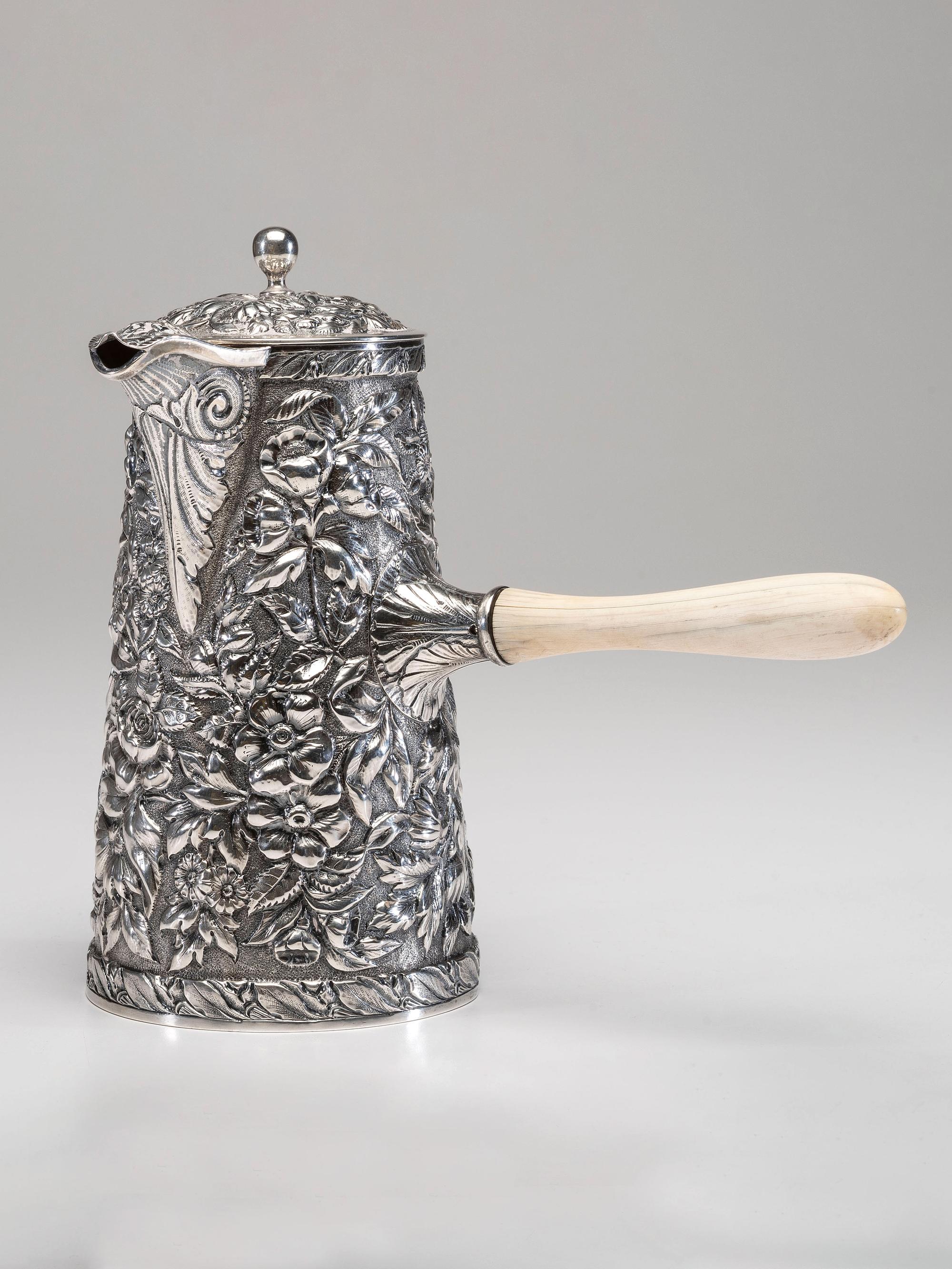 An American Silver Repoussé Chocolate Pot