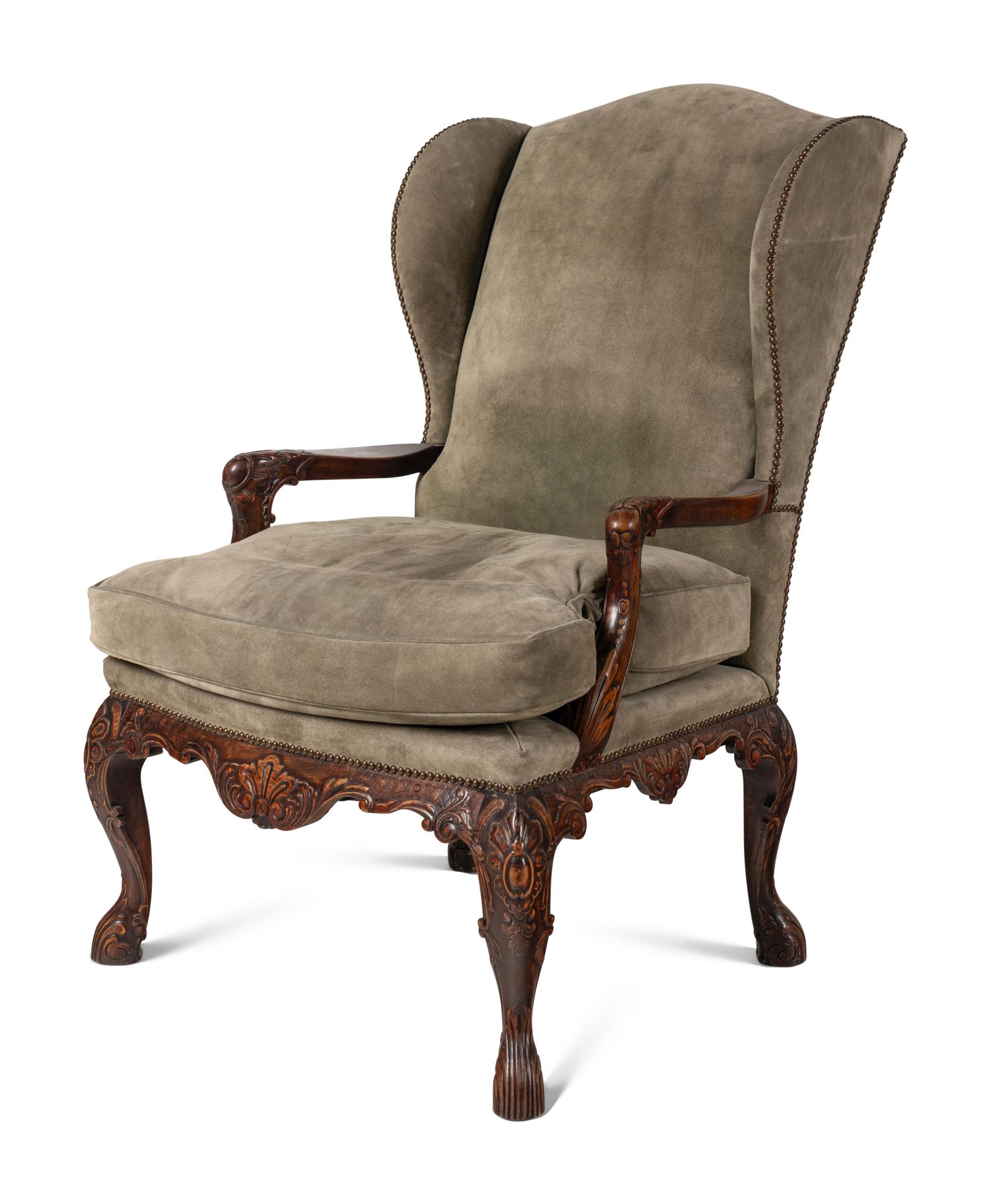 A Pair of Régence Style Suede Upholstered Walnut Wingback Fauteuils