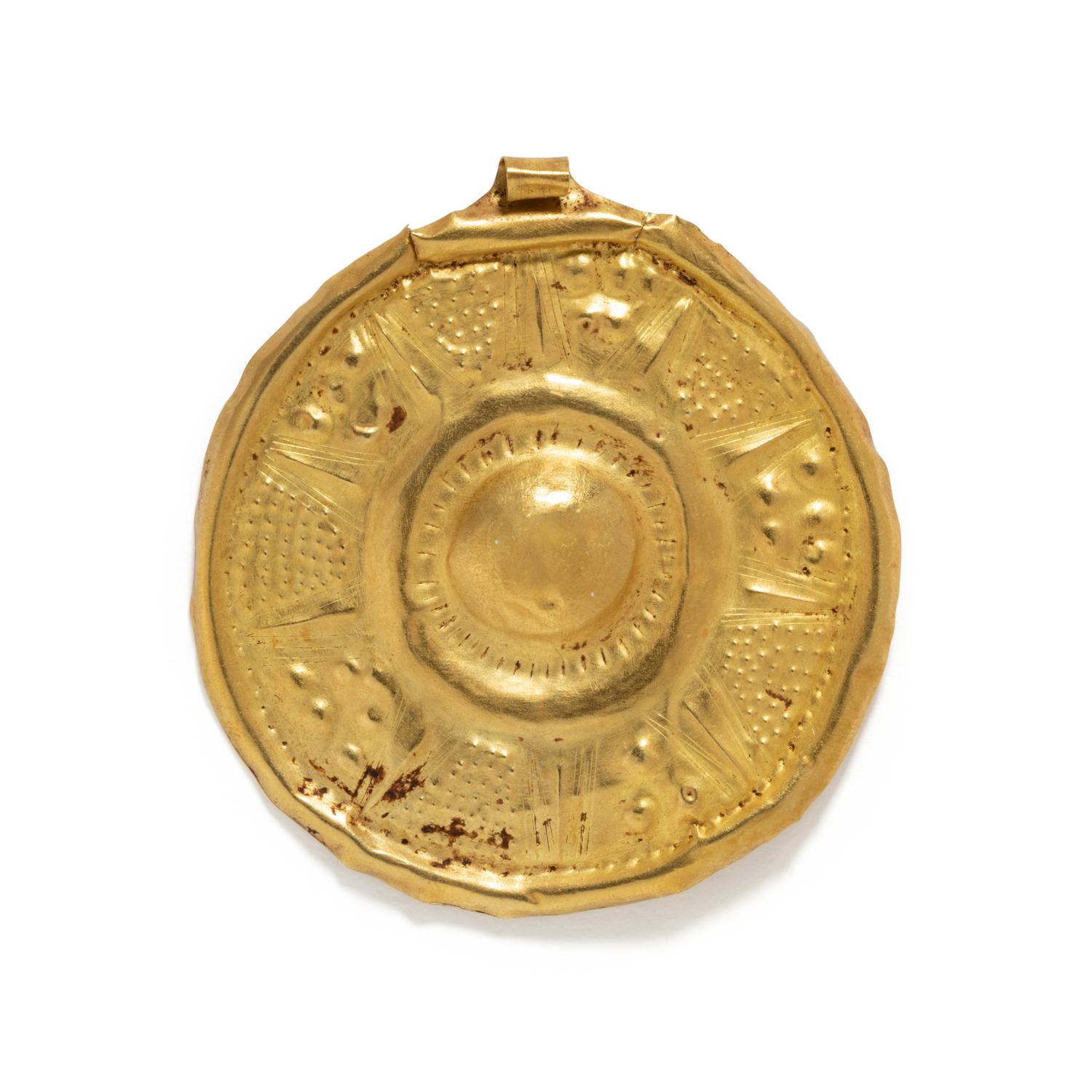 A Near Eastern Gold Disk Pendant