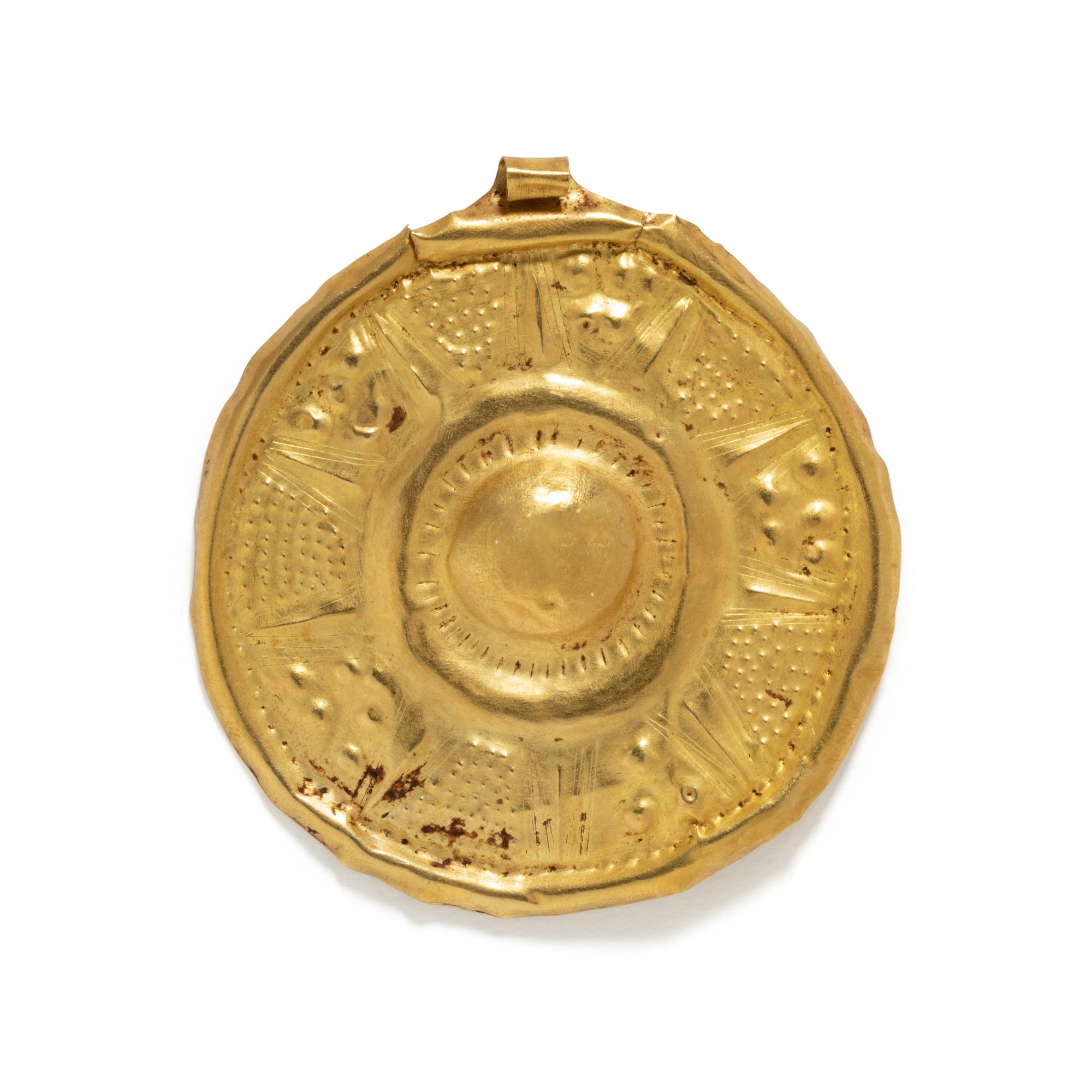 A Near Eastern Gold Disk Pendant