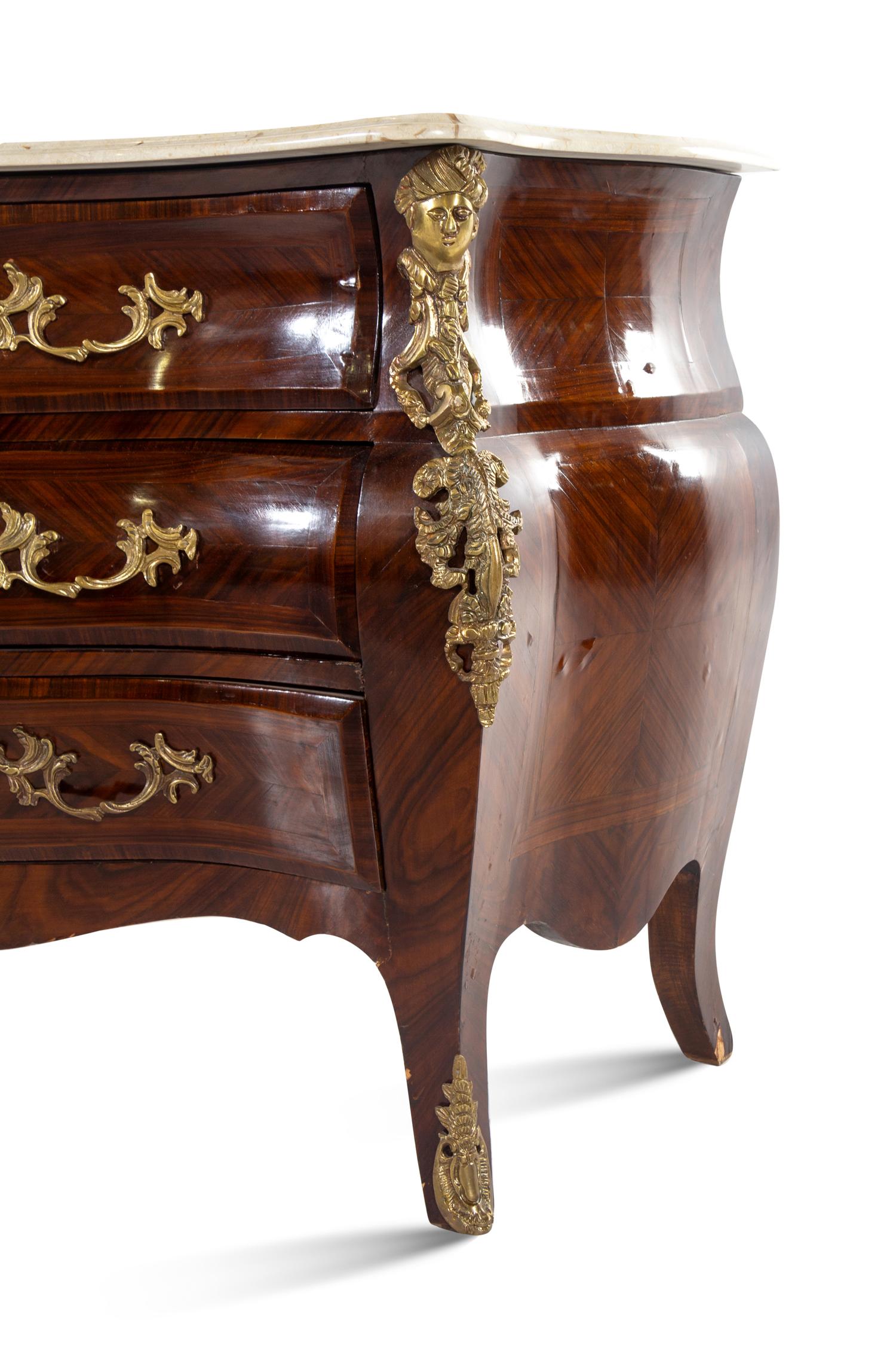 A Régence Style Gilt Bronze Mounted Tulipwood Commode
