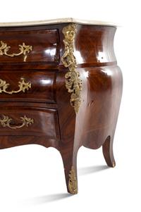 A Régence Style Gilt Bronze Mounted Tulipwood Commode