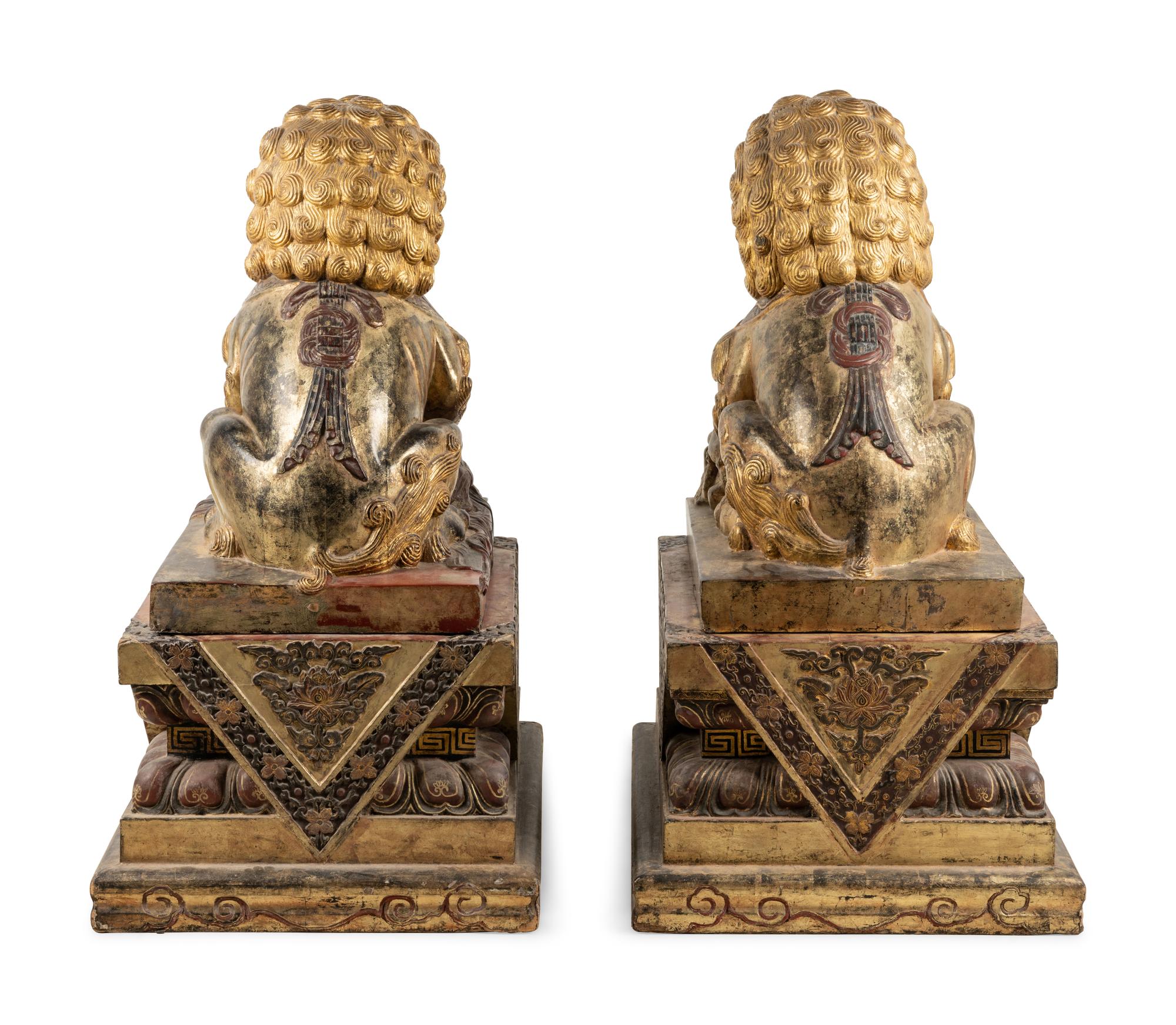 A Pair of Large Chinese Giltwood and Composition Buddhistic Lions