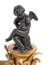 A Pair of French Gilt and Patinated Bronze Figural Chenets