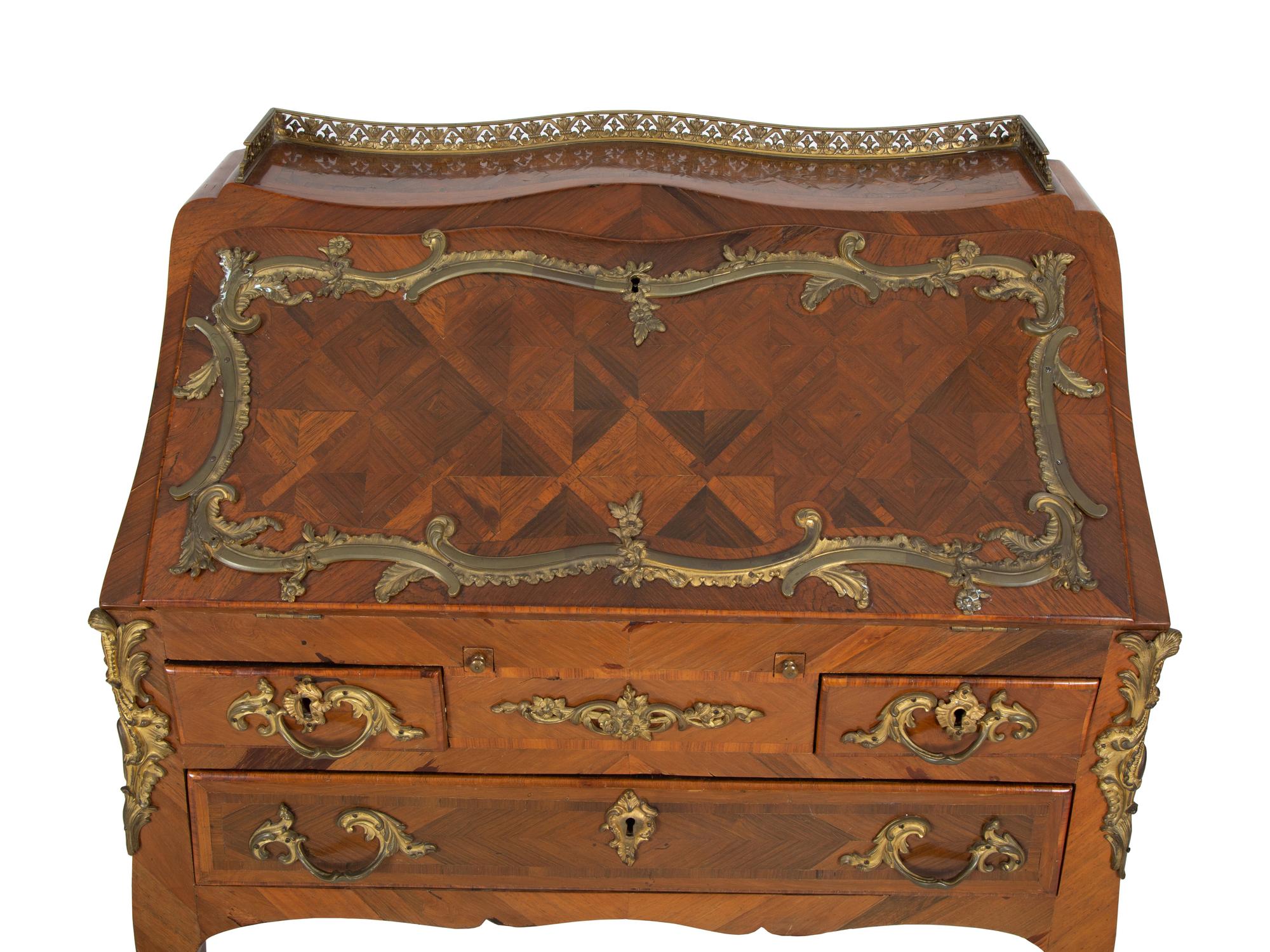 A Louis XV Style Parquetry Inlaid Writing Desk with Brass Gallery