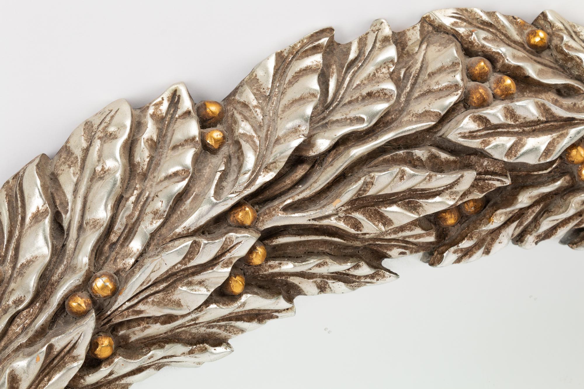 A Pair of Carved, Gilt and Silvered Wood Laurel Wreath Mirrors
