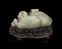 A Pale Celadon Jade 'Qilin and Book' Carving
