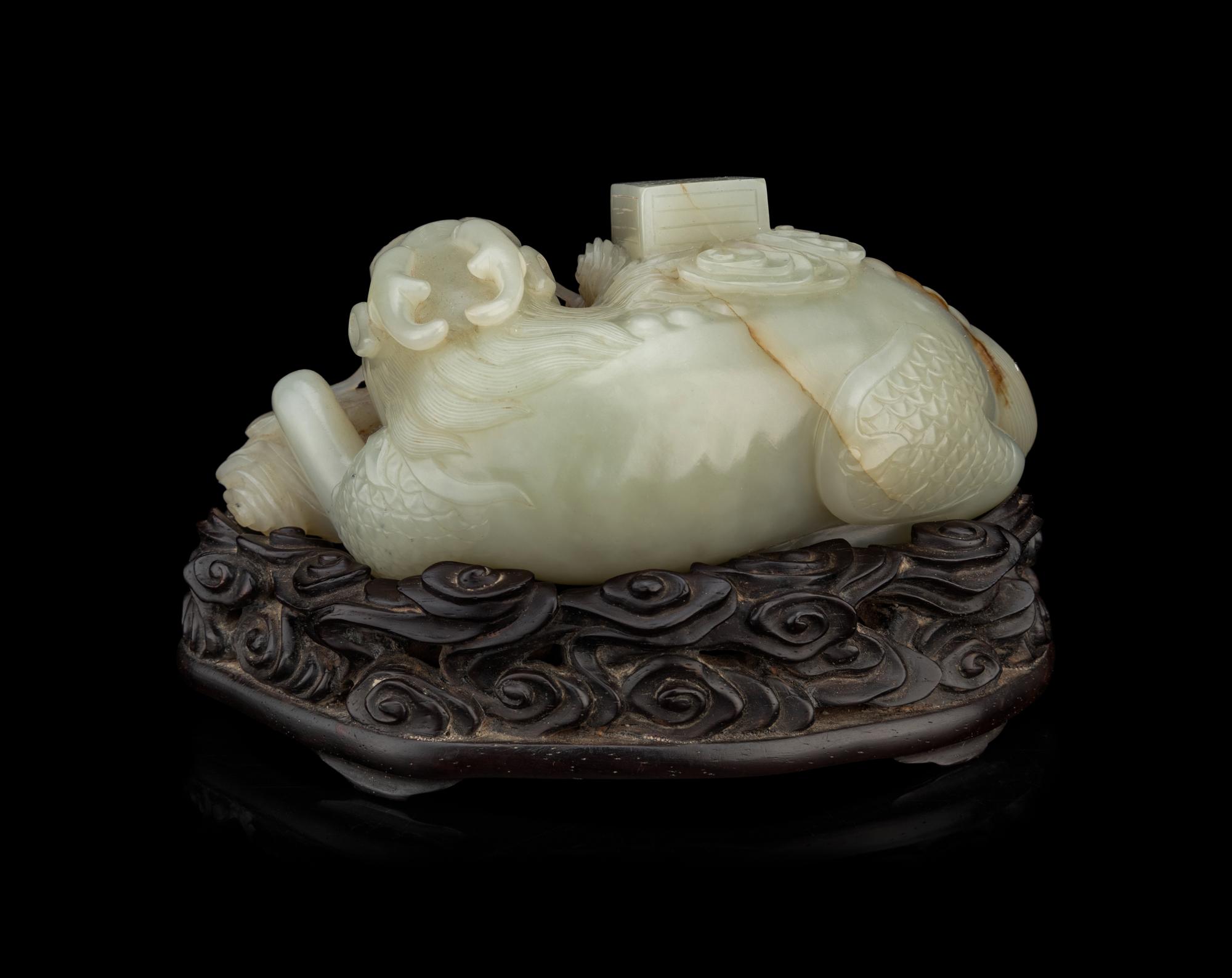 A Pale Celadon Jade 'Qilin and Book' Carving
