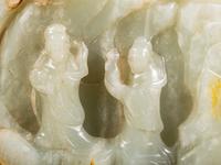 A Chinese Celadon and Russet Jade Boulder