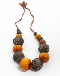 An Amber and Metal Beaded Necklace Length overall 14 1/2 inches.