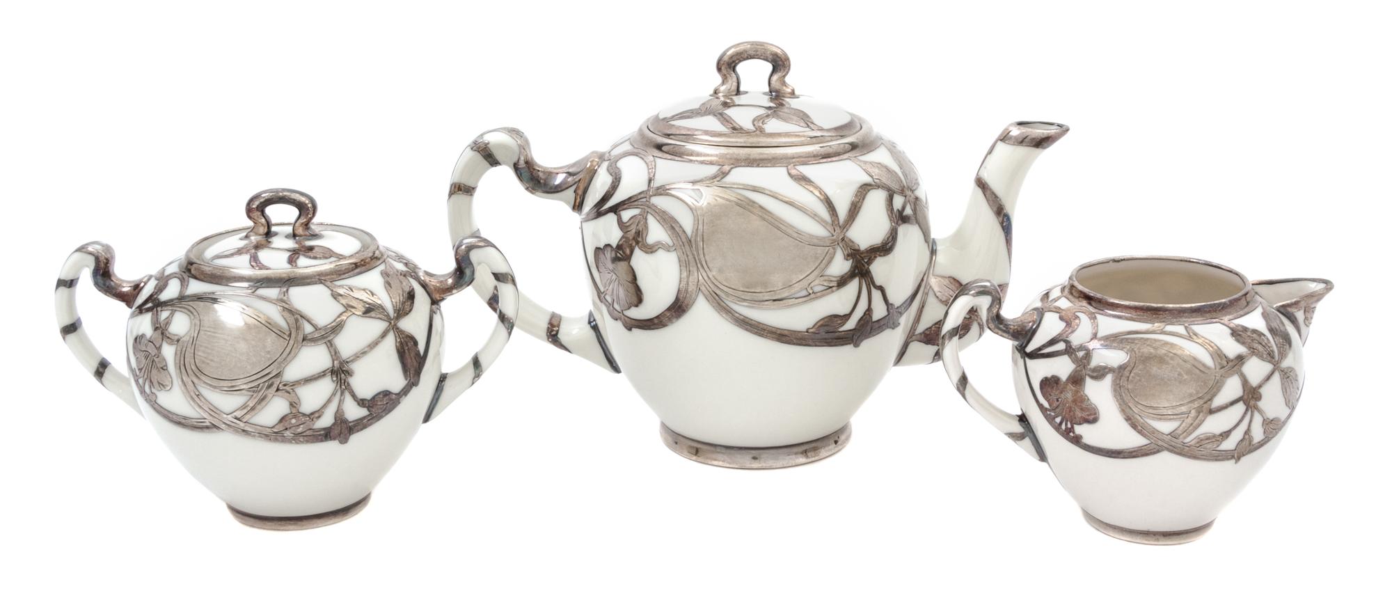 A Lenox Porcelain Silver Overlay Tea Service Height of teapot 5 inches.