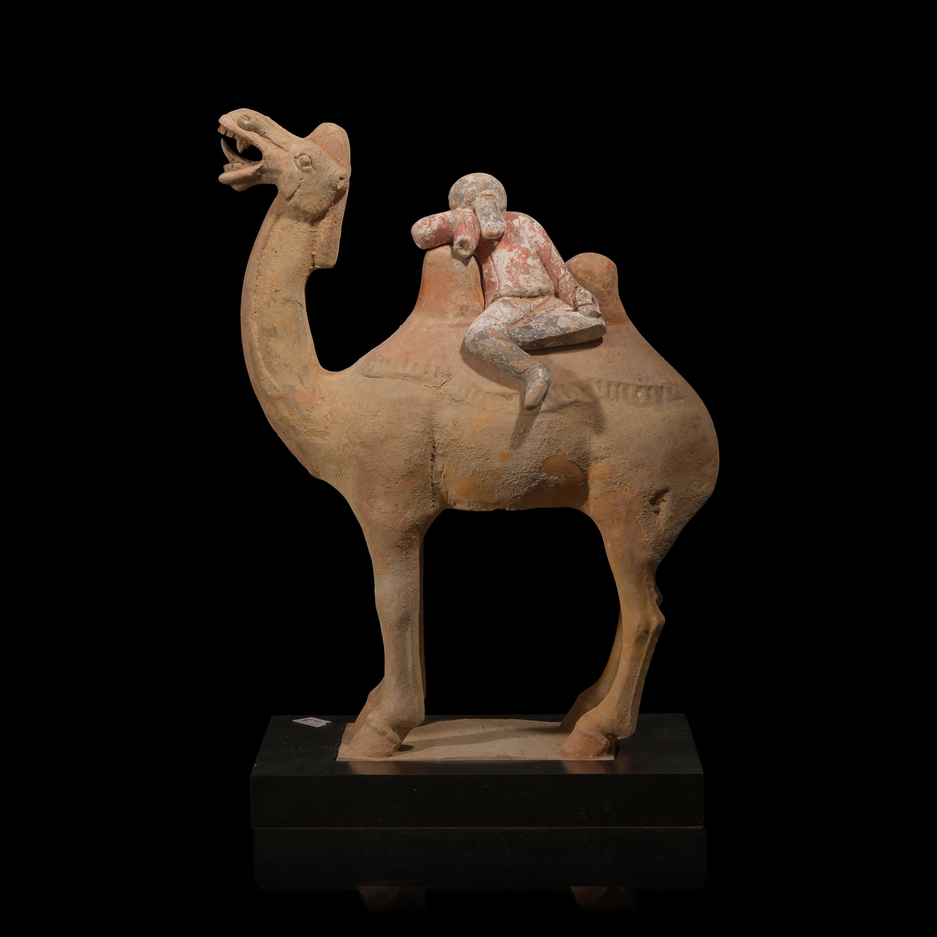 A Chinese Painted Pottery Figural Group of a Camel and a Rider, Possibly Tang Dynasty — 或為唐 陶加彩駱駝俑