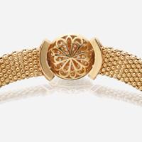An eighteen karat gold, diamond, and ruby necklace