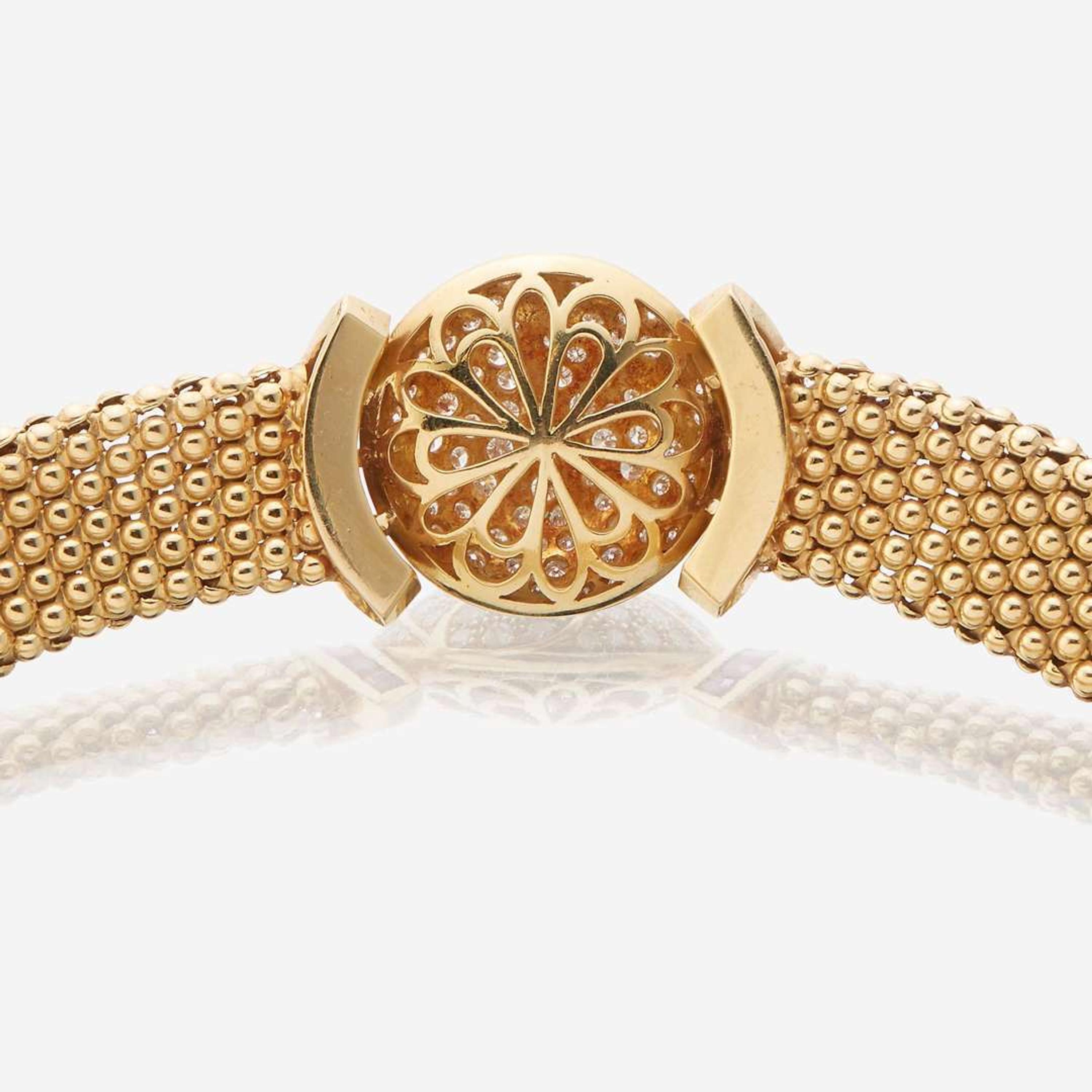 An eighteen karat gold, diamond, and ruby necklace