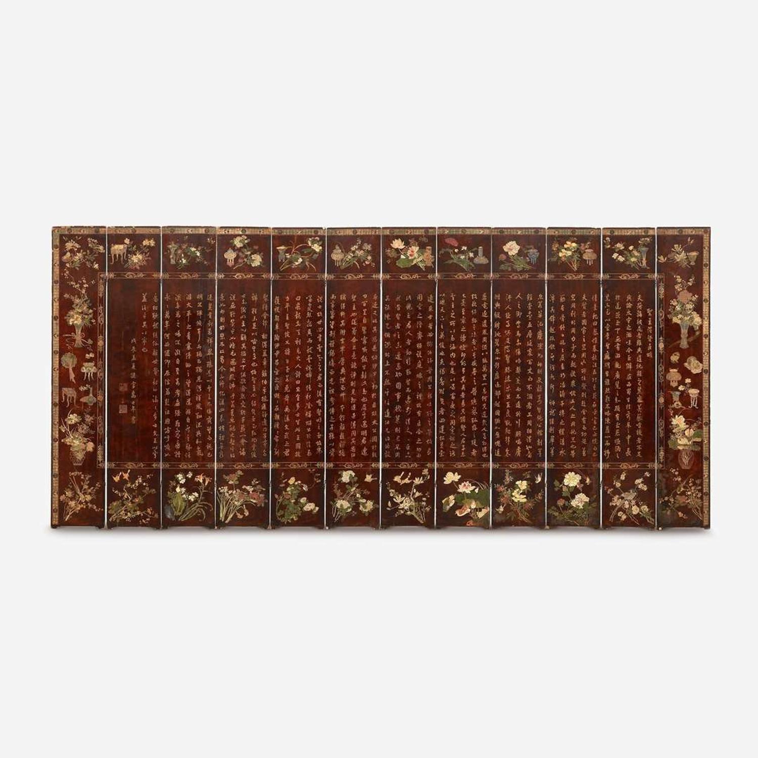 A Chinese carved twelve-panel "Coromandel" folding screen 17th/18th Century