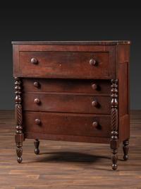 A Classical Tennessee Carved Cherrywood Chest of Drawers