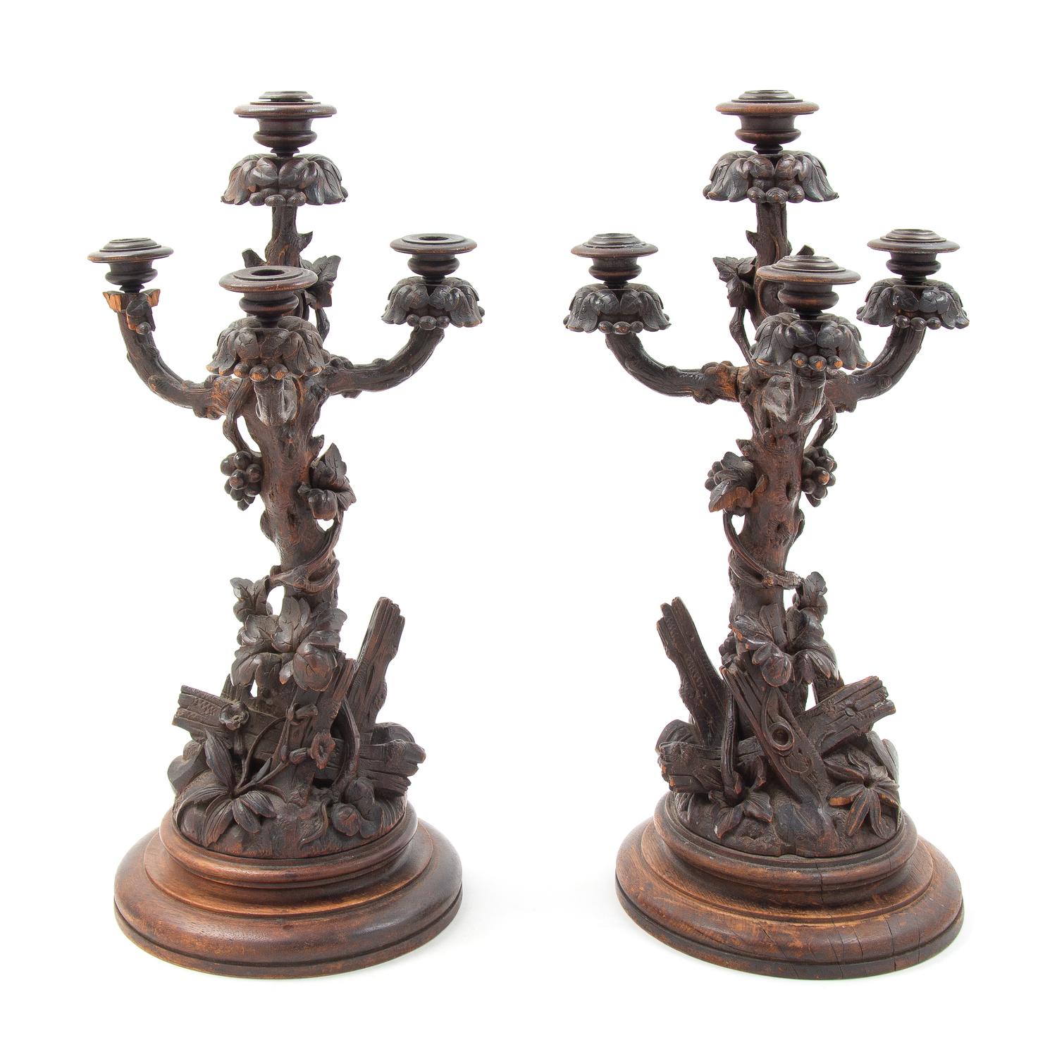 A Pair of Black Forest Candelabra Height of first 21 1/4 inches. — LATE 19TH CENTURY