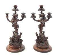 A Pair of Black Forest Candelabra Height of first 21 1/4 inches. — LATE 19TH CENTURY