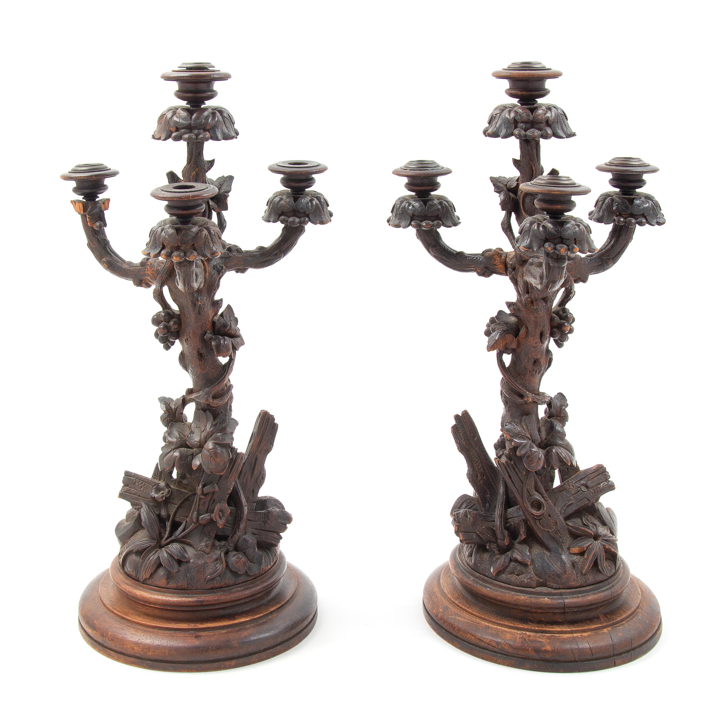 A Pair of Black Forest Candelabra Height of first 21 1/4 inches. — LATE 19TH CENTURY