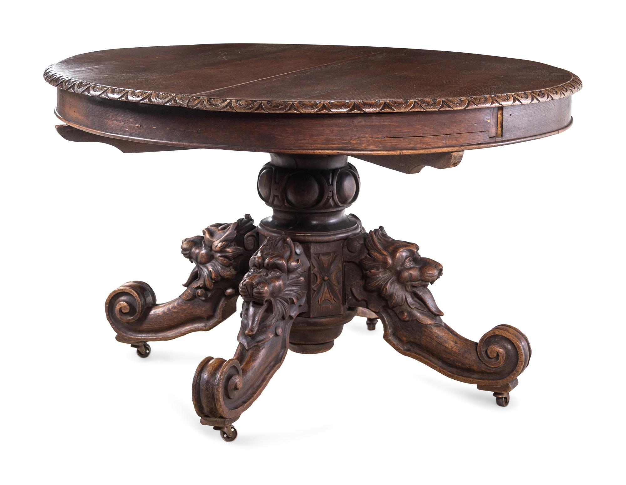 A Renaissance Revival Carved Walnut Breakfast Table and Chairs