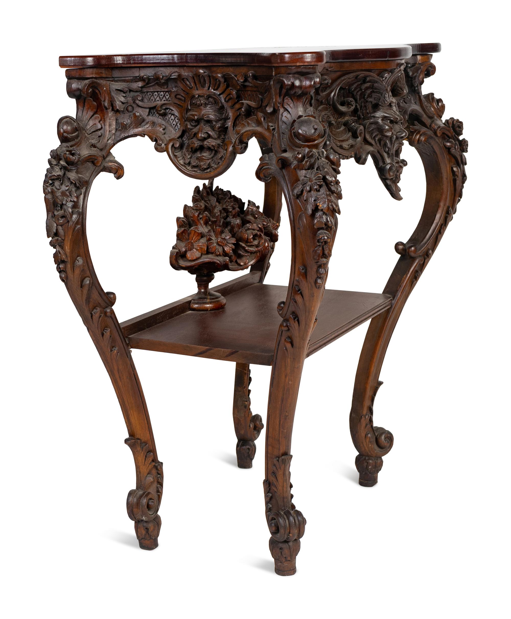 A Renaissance Revival Carved Walnut Serpentine Top Console Table