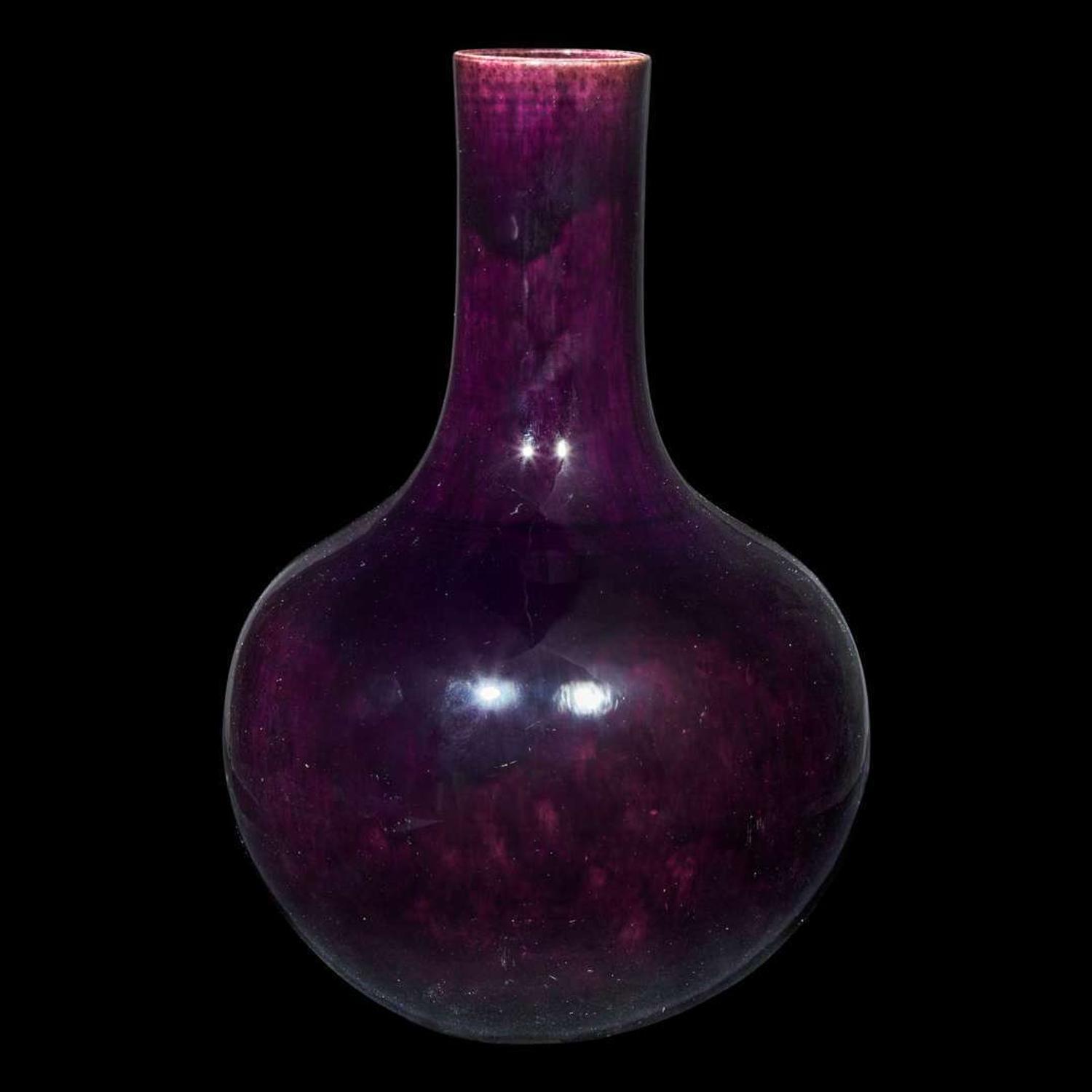 A Chinese aubergine-glazed porcelain bottle vase, Tianqiuping 茄皮紫天球瓶一只