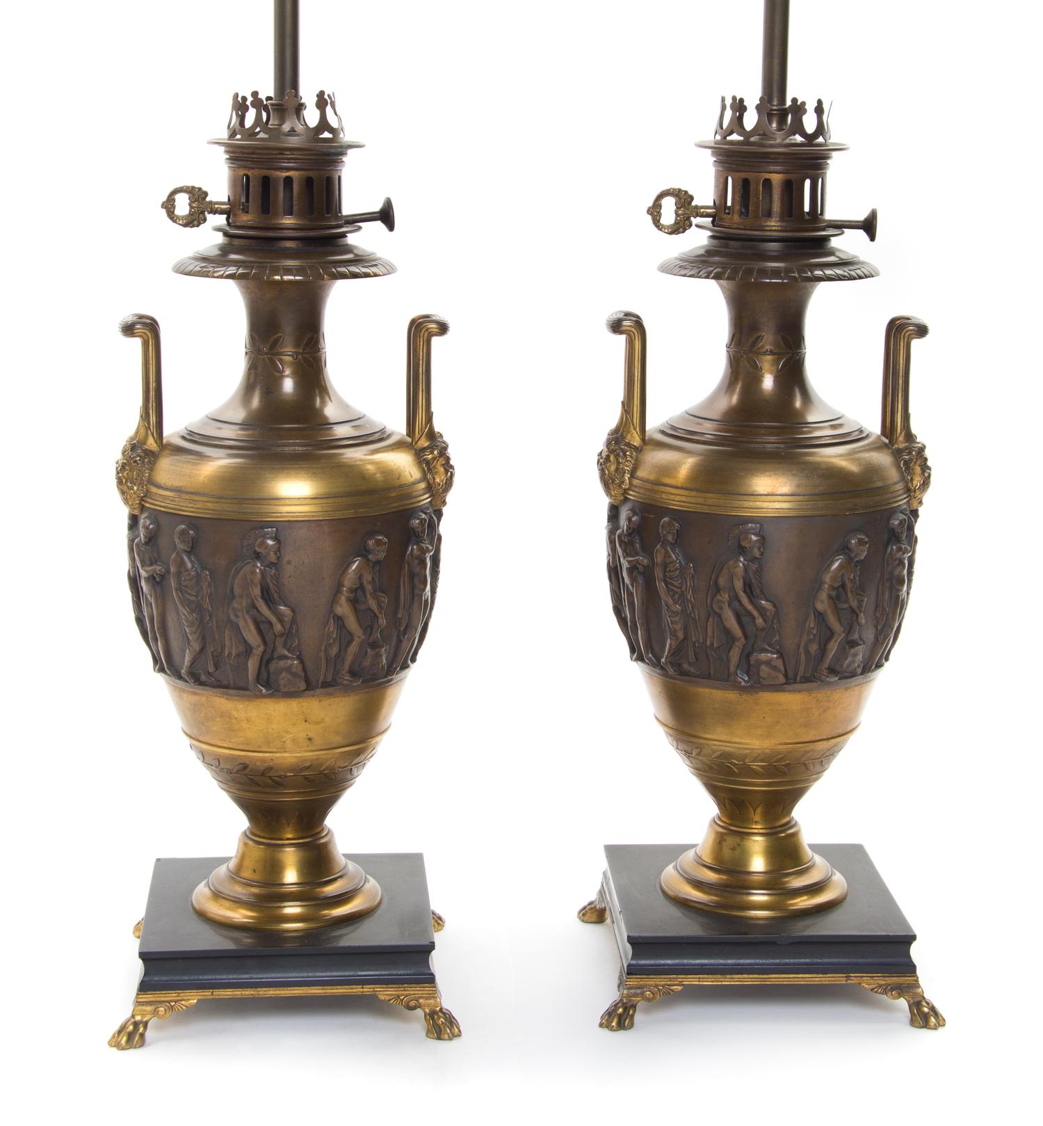 A Pair of Neoclassical Gilt and Patinated Bronze Urns Height 32 inches.