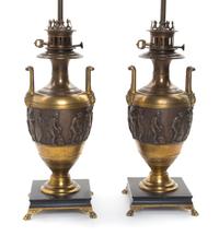 A Pair of Neoclassical Gilt and Patinated Bronze Urns Height 32 inches.