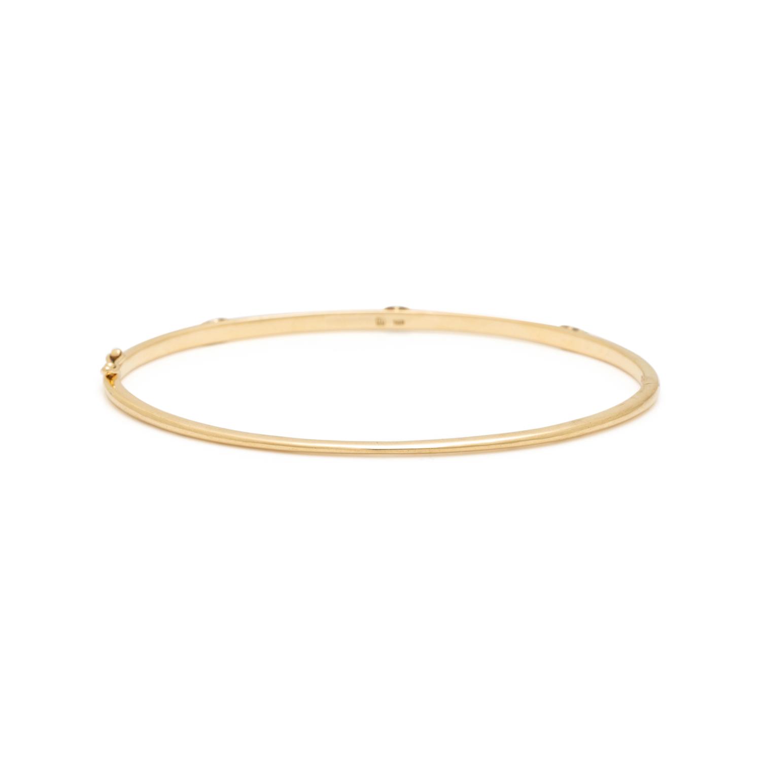 ANNA SHEFFIELD, YELLOW GOLD AND DIAMOND 'CELESTINE' BANGLE BRACELET