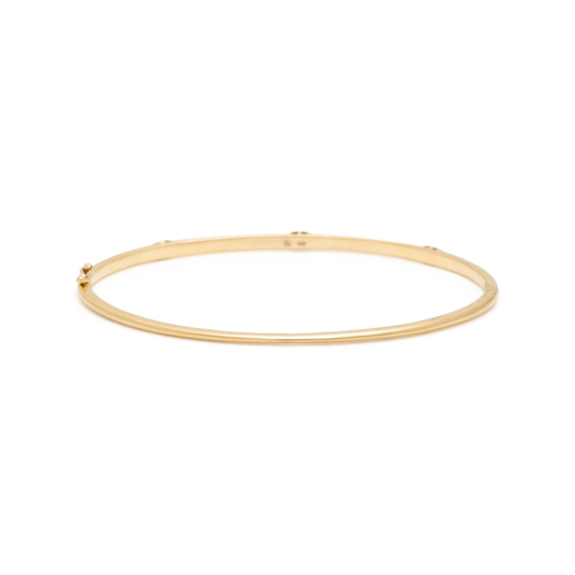 ANNA SHEFFIELD, YELLOW GOLD AND DIAMOND 'CELESTINE' BANGLE BRACELET