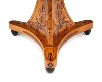 A Charles X Style Burlwood and Marquetry Center Table