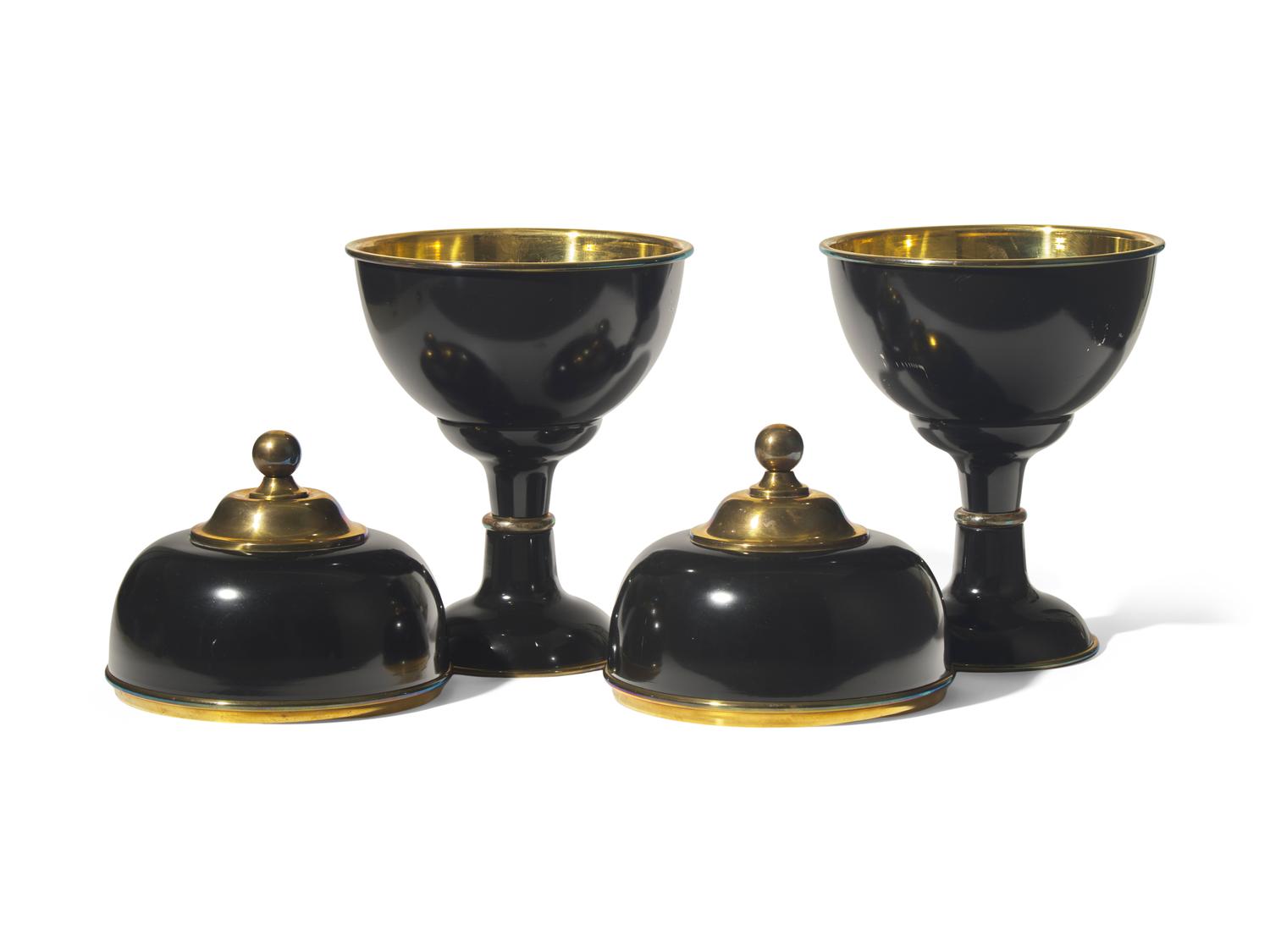 A Pair of Large Black Enameled and Brass Lidded Urns DONATED BY NATE BERKUS