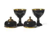 A Pair of Large Black Enameled and Brass Lidded Urns DONATED BY NATE BERKUS