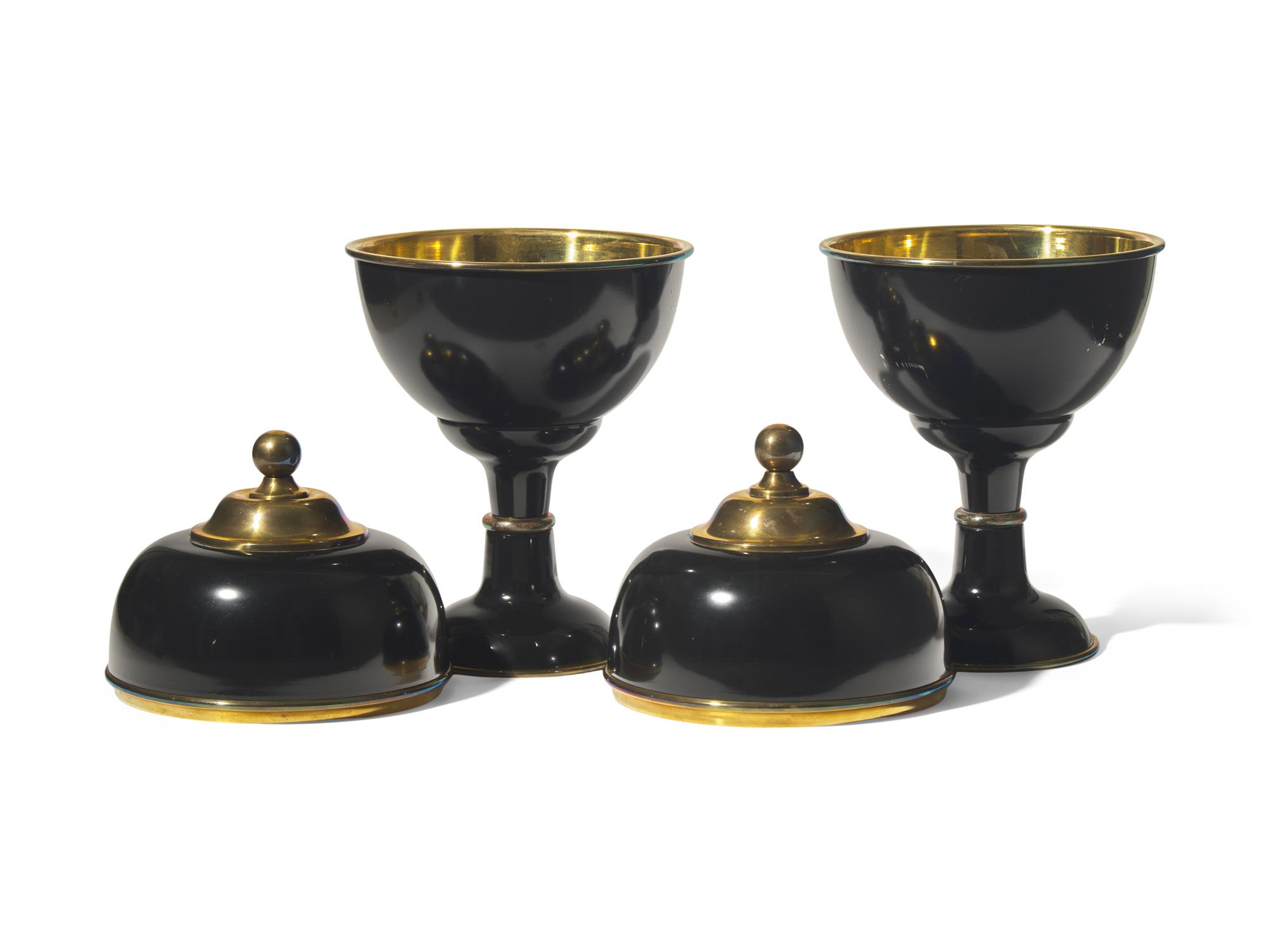 A Pair of Large Black Enameled and Brass Lidded Urns DONATED BY NATE BERKUS