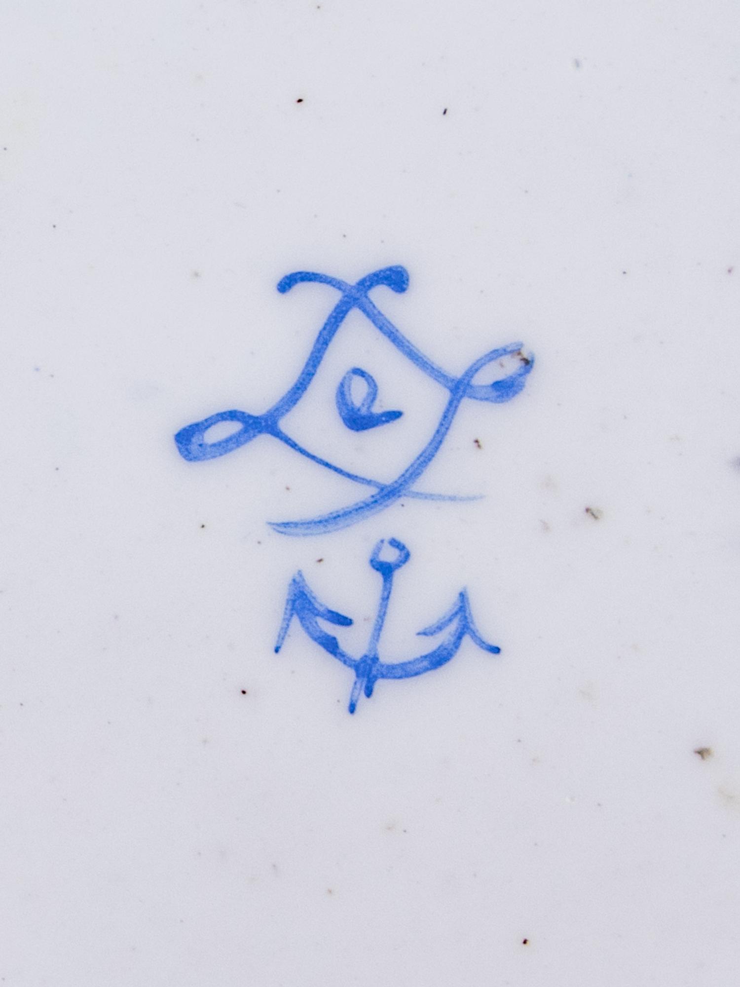 Three Sèvres Painted, Parcel Gilt and "Jeweled" Celeste Blue-Ground Porcelain Teacups and Saucers
