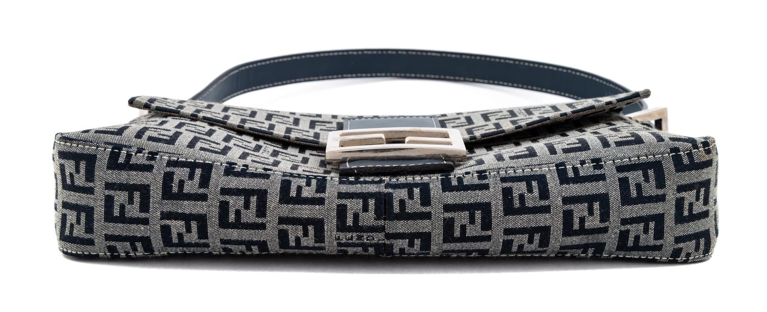 A Fendi Navy Monogram Canvas Zucca Baguette, 5" H x 10.25" W x 1.75" D; Strap drop: 6.5"- 9.5".