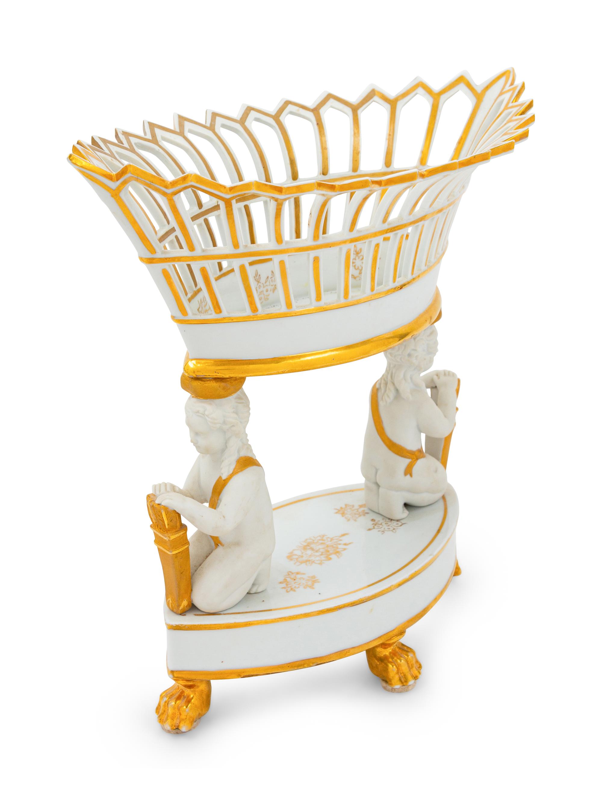 A Paris Porcelain Parcel Gilt Figural Fruit Basket